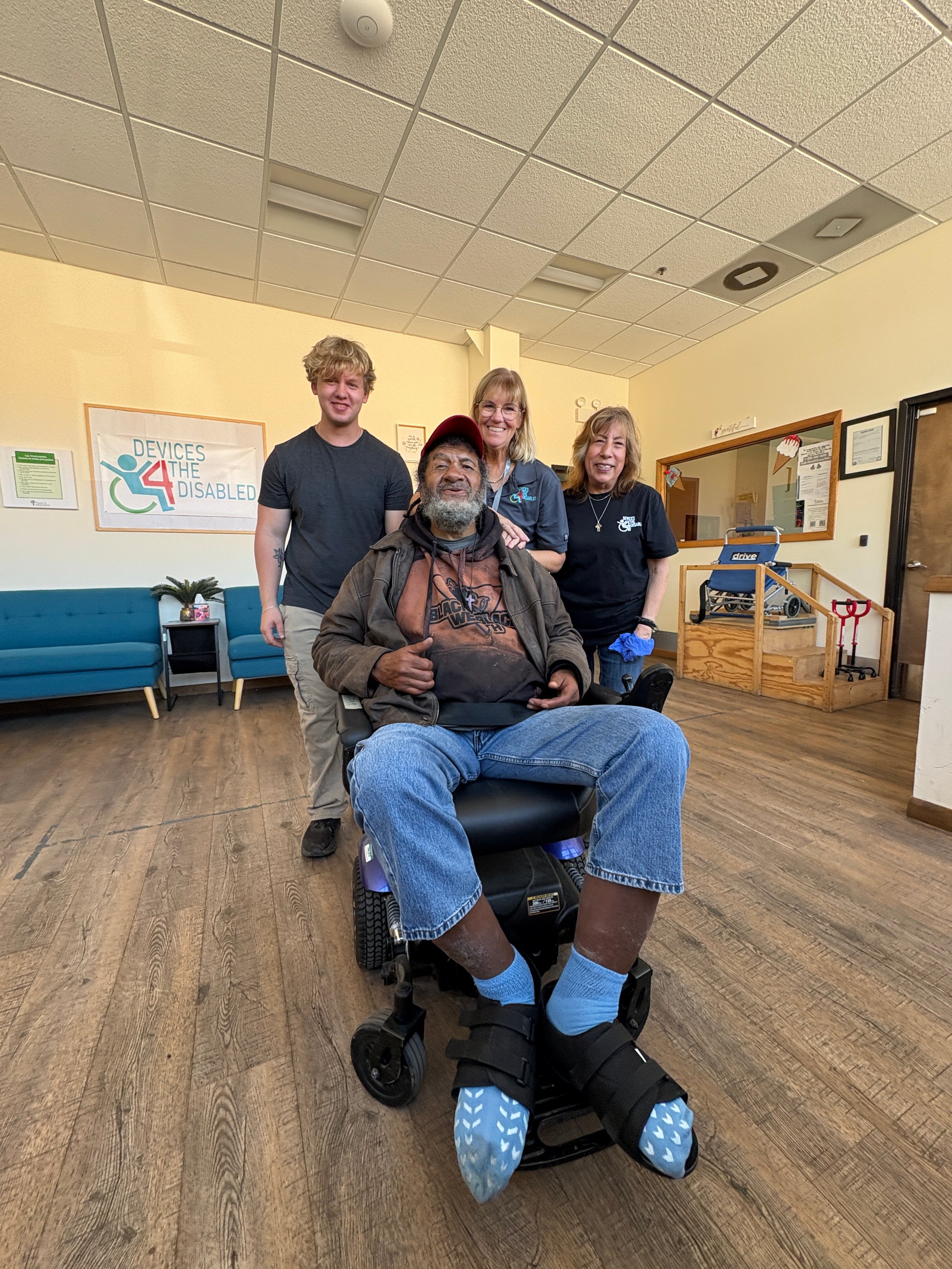 Zach (back left) with D4D team and recipient